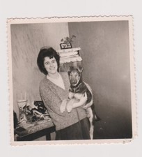 Photo woman holding a puppy dog German shepherd dog dog woman