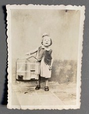 PHOTO little girl with a bird cage child