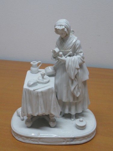 Statue porcelaine titrée - en,