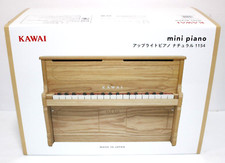 Mini piano droit Kawai 1154