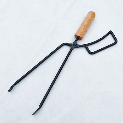 Iron and wood fire - and, tong