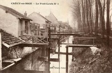 CRECY LA CHAPELLE en Brie Le Pont Levis No. 1 A lady reads her diary