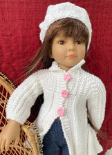 manteau et bonnet blanc pour