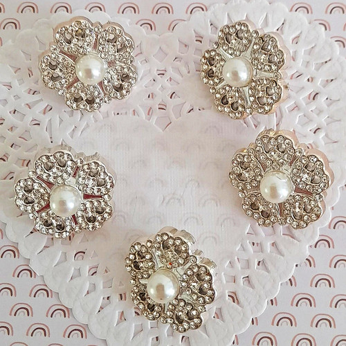 Boutons fleurs queue strass - à,