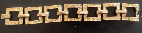 Bracelet metal doré signé