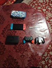 Nintendo Switch 32 Go Console Portable avec Manettes Joy-Con Bleu Néon/Rouge...