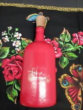 Glass bottle, coated with red faux leather, advertising