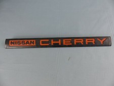 NISSAN CHERRY sigle monogramme