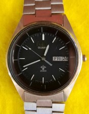 Pulsar V103-6059 Black face. Original Bracelet and Manual. Needs a capacitor.