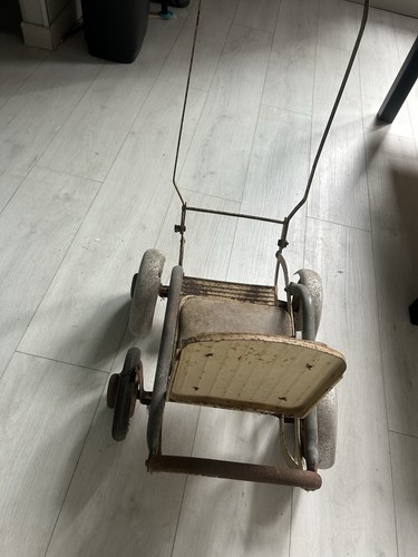 Antique wheel metal doll - antique,