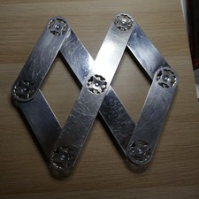 Ancien dessous de plat en inox