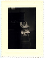 Child in high chair - kitchen - old photo year. 1950