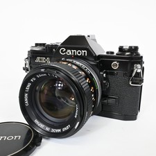 Appareil photo reflex argentique 35 mm Canon AE-1 noir avec objectif FD 50 mm...