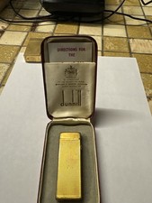 Briquet de luxe Dunhill Rollagas finition plaqué or avec motif guilloché