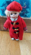 Antique Porcelain Collectible Doll with Coat and Red Hat