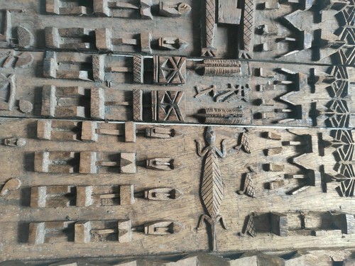 African characters carved - african,