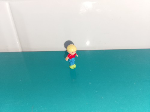 Polly pocket figurine doll