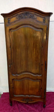 Louis XV Provencal style carved walnut bonnetière 20th century.