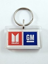 PORTE-CLES - Bourbon ISUZU GENERAL MOTORS - Double Face Vintage Garages 1990s