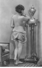 Nude - Woman on the back, wearing only one underwear, leaning against a healed