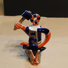 Figurine porcelaine forgeron