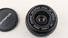 Objectif grand angle Olympus Zuiko Auto-W 35mm F2.8 OM avec bouchons