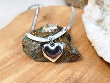Collier en acier inoxydable argenté avec pendentif en forme de coeur