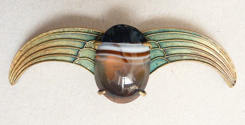 Broche métal doré - en,