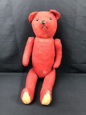 Ancien ours en peluche rouge