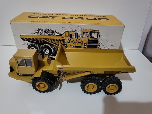 Dumper articulé caterpillar - dumper,