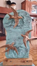 hirondelles en bronze sur