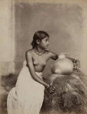 Girl from Ceylon (Sri Lanka) posing with an earthen pot.  Vintage print, e