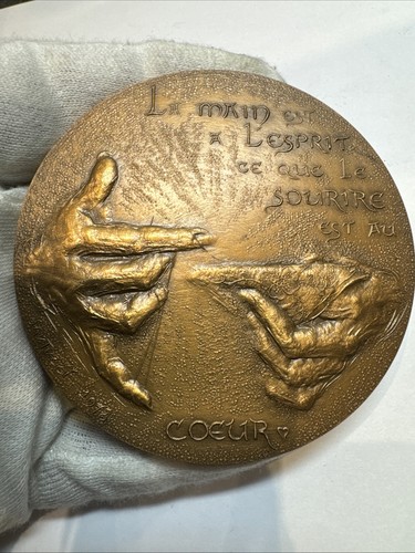 Medaille création la - création,