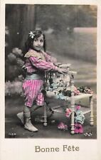 CP BON FETE CHILD WITH CHAIR FLOWERS - 62726