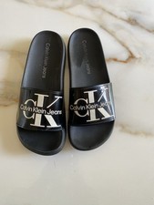 Description Elegant black footwear with textured design. Features Calvin Klein