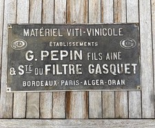 PLAQUE publicitaire en fonte
