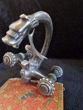 Old bathtub tap mixer, chimera-shaped, grass France