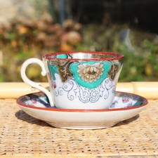 Tasse et soucoupe en faïence