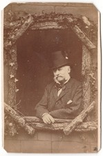 Man top leaning against a window wood decor circa 1874 photo CDV