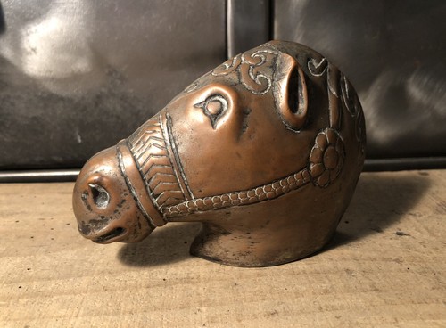 Copper horse head press