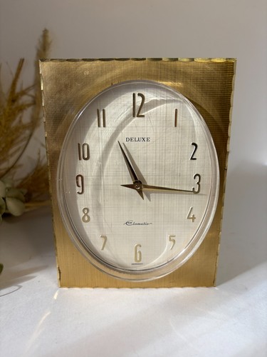 Horloge métal doré - en,
