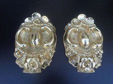 pair of antique curtain rod kisses, brass pushed back Nap III