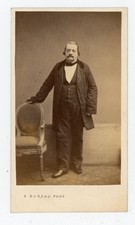 CDV PHOTO, a moustached man near an armchair by office in Paris circa 1860