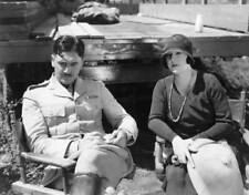 Actor Richard Dix sits Margaret Chute location during shootin- 1930 Old Photo