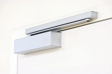 Ferme-porte en applique à