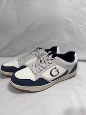 Stylish Guess sneakers in beige and black. Perfect for everyday wear.