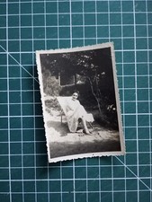 VR413 photo circa 1950 young woman in a deckchair in the garden
