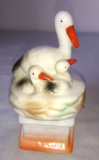 OLD PIGGY BANK FIGURINE STORK AND STORK ON FIREPLACE PORCELAIN 1950