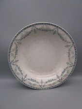 Plat creux ancien en faïence