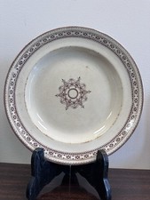 Assiette ancienne en faïence – Décor géométrique floral brun